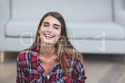 Beautiful woman smiling in living room