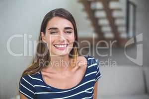 Beautiful woman smiling in living room