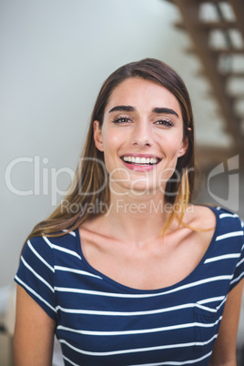 Beautiful woman smiling in living room