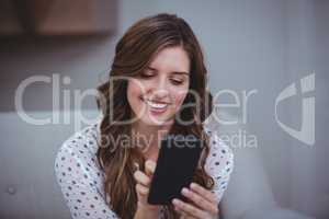 Beautiful woman using her mobile phone