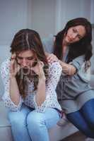 Woman comforting her upset friend