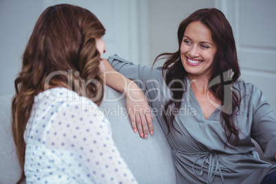 Two beautiful woman interacting with each other