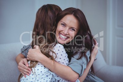 Two female friends embracing each other