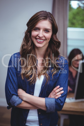 Portrait of beautiful woman standing with arms crossed Portrait of beautiful woman standing with arms crossed