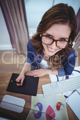 Portrait of beautiful woman using pen tablet