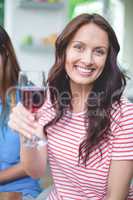 Beautiful woman holding a glass of red wine