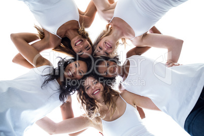 Happy women forming a huddle