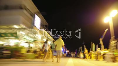 Hyperlapse of people on the streets in night resort city
