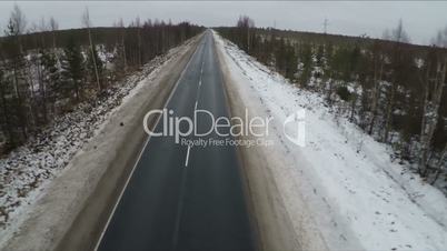 Flying over empty road in the north
