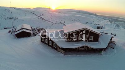Flying over the winter ski centre at sunset