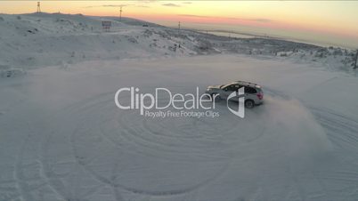 Flying over the car drifting on snow