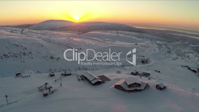 Flying over the ski centre area at sunset