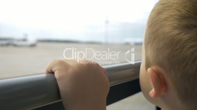 Child having a bus ride on airport area