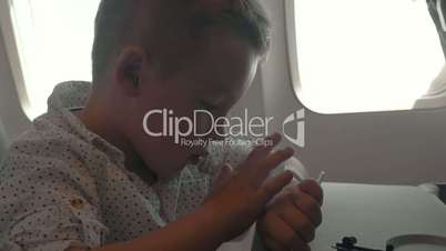 Child using smart watch during air travel