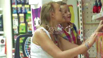 Mother and son in toy shop