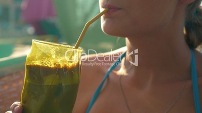 Woman Drinking Ice Coffee in Hot Day