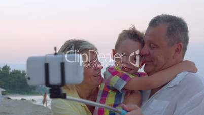 Family mobile selfie with child and grandparents