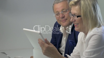 Businesspeople Working with Tablet