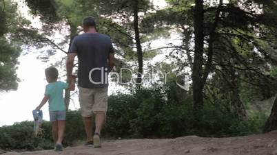 Man and Boy Walking in the Park