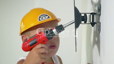 Child playing a repair at home