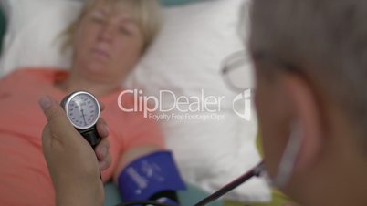 Measuring womans blood pressure