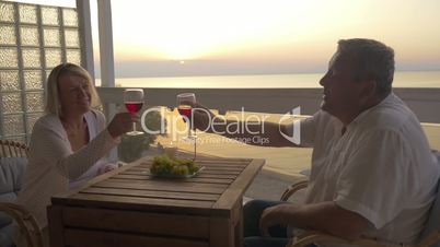 Mature couple spending time on drinking wine