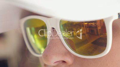 Close-up of woman wearing mirrored sunglasses
