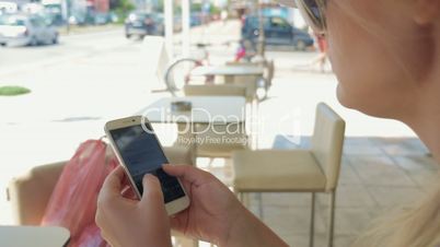 Woman typing and sending message on mobile