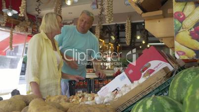 People Buying Tomatoes in Greengrocery