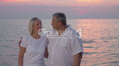 Smiling mature couple looking to the camera