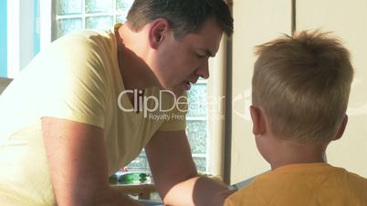 Father Reading Book to His Son