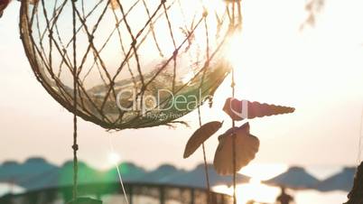 Decorative globe with shells jingling in the wind