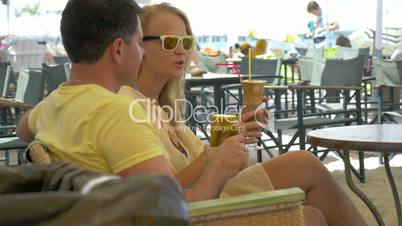 Couple Having a Date in Outdoor Cafe