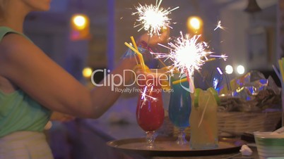 Serving Cocktail Glasses with Sparklers in Them