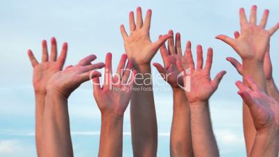 People raising hands up