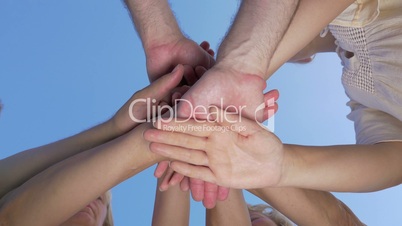 People making stack of hands