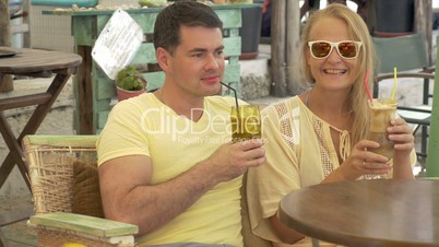 Couple Drinking Ice Coffee and Talking
