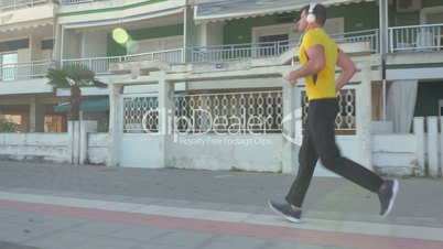 Side view of man jogging in the morning