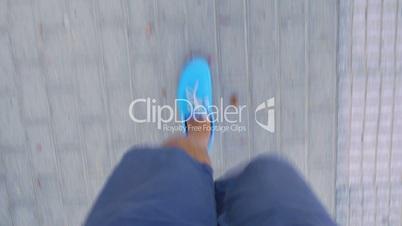 Timelapse of male feet walking on sidewalk