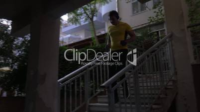 Man leaving hotel to have workout on water front