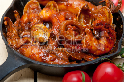 fresh seafoos stew on an iron skillet