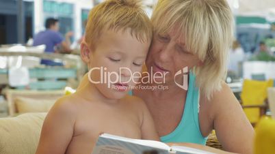 Child with grandmother and book