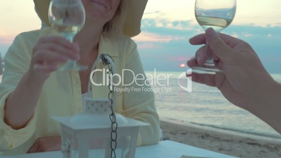 Smiling Woman Listening a Toast and Drinking Wine