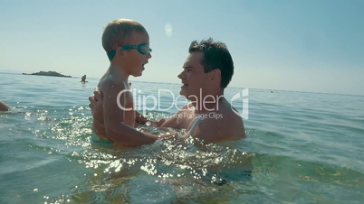 Enjoyable sea bathing with father
