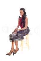 African American woman sitting on chair.