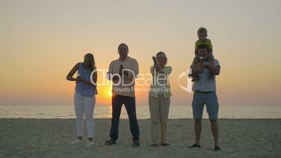 Family celebration with confetti on the beach