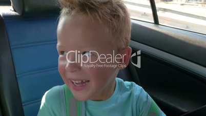Little Boy on a Car Back Seat