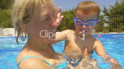 Child swimming underwater in pool