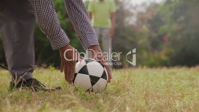 10-Grandpa Playing Soccer Football With Boy