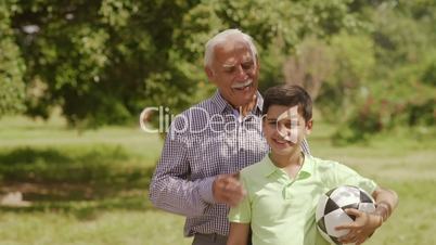 13-Portrait Happy Family Grandparents And Boy With Soccer Ball